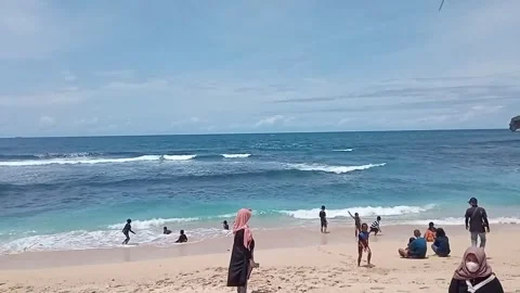 Stunning Tropical Beach with Turquoise Waves and Holidaymakers in Yogyakarta Stock Footage 319926701
