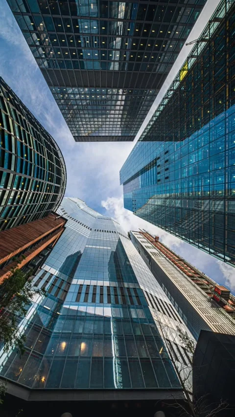 Stunning Urban Skyscraper View from Ground with Dramatic Sky Stock Footage 306459928