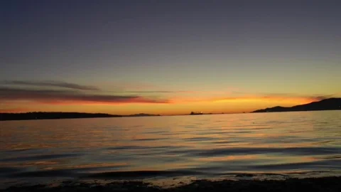 Stunning Vancouver Beach Sunset with Gentle Close up Ocean Ripples. Stock Footage
