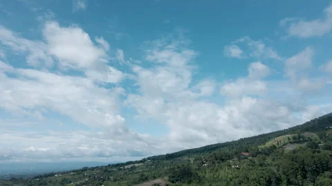 A stunning vertical drone timelapse capturing the vast green hills, Stock Footage 303457962