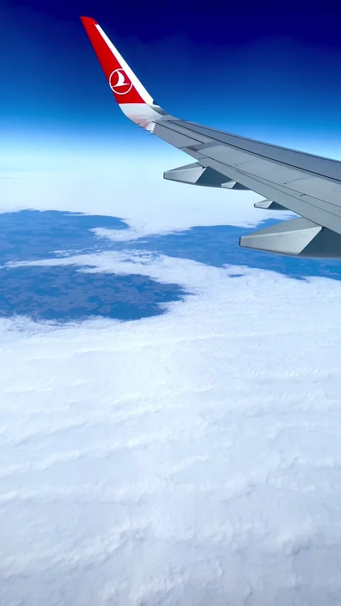 A stunning vertical video captured from an airplane window as it descends Stock Footage 297294802