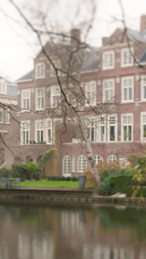 A stunning video shows a brick building reflected in a pond Stock Footage 319624264