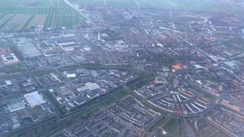 Stunning View in 4K from a airplane as it circles over the city of Amsterdam Stock-Footage 79796406