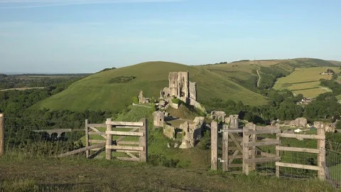 Stunning view (in 4K) of Corfe Castle through a footpath gate, Dorset, UK. Stock Footage