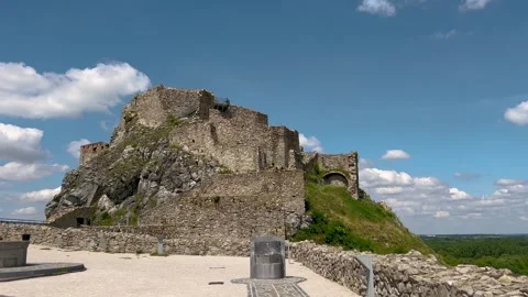 A stunning view of an ancient stone castle atop a rocky hill, surrounded 스톡 동영상 297713977