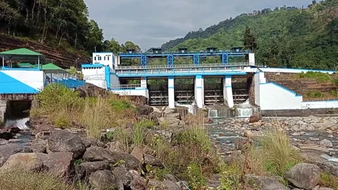 A stunning view of Bindu Dam featuring a blue-roofed structure Stock Footage 278052942