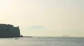 Stunning view on Castel dell Ovo, Gulf of Naples and Vesuvius mount in haze HD Footage
