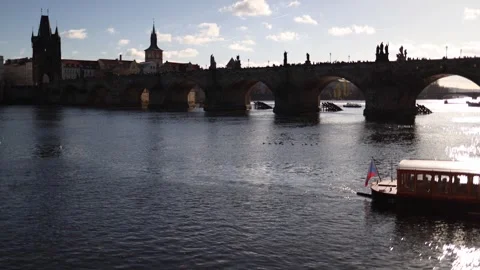 A stunning view of Charles Bridge in Prague with its iconic arches reflected in  Stock Footage 293469673