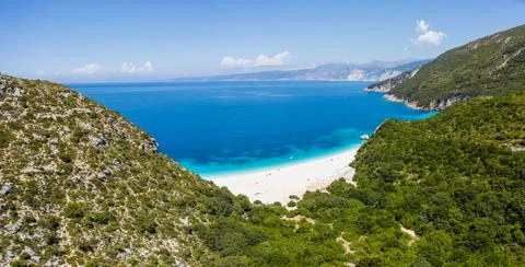 Stunning view of Fteri beach with white sailboat in hidden bay, Kefalonia Stock Photos