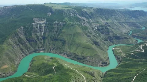 Stunning view of green deep canyon with turquoise river Video stock 223836237