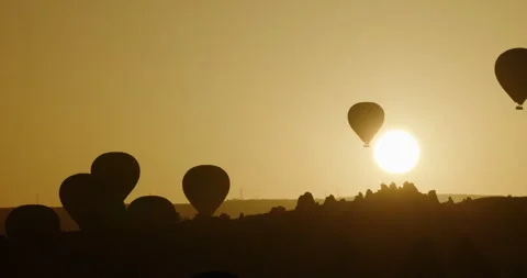 Stunning View of Hot Air Balloons Rising Over the Unique Landscape of Cappadocia Stock Footage 252000643