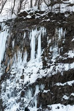 A stunning view of an icefall cascading from a river cliff in Rudawka Rymanowska Stock Photos