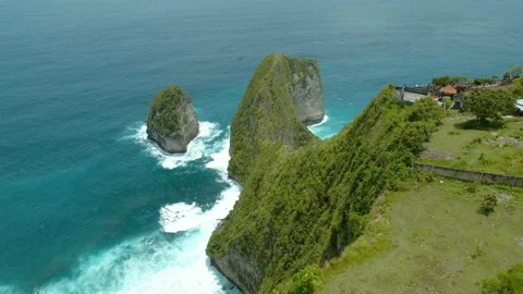 Stunning view of jagged cliffs and the deep blue ocean at Kelingking Beach, Nusa Stock Footage 295077194