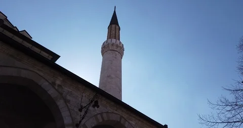 Stunning view of a mosque tower with cloudy blue sky in the background Stock Footage 126879474