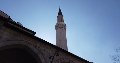 Stunning view of a mosque tower with cloudy blue sky in the background Stock Footage 126879690