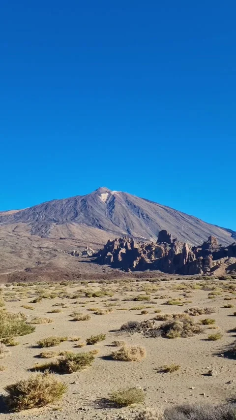 A stunning view of Mount Teide as seen from a moving car, with the vast landscap Stock Footage 307636241