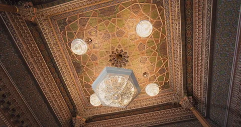 Stunning view of painted wood ceiling and ganch carving chandelier in The State Stock Footage 250628506