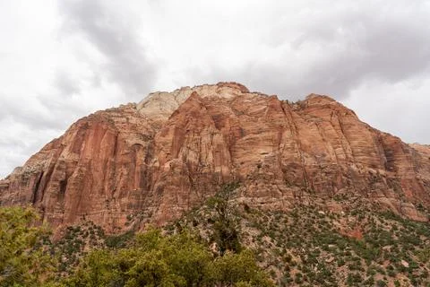 A stunning view of red rocks on a cloudy day at Zion National Park, Utah. Stock Photos