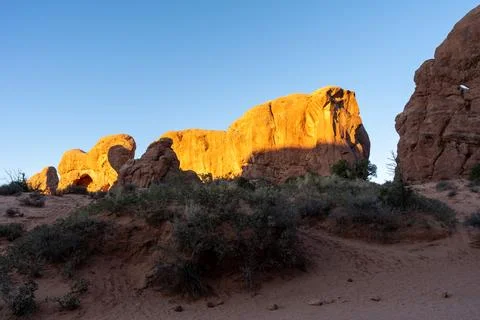 A stunning view of red rocks during golden hour in Arches National Park. Stock Photos