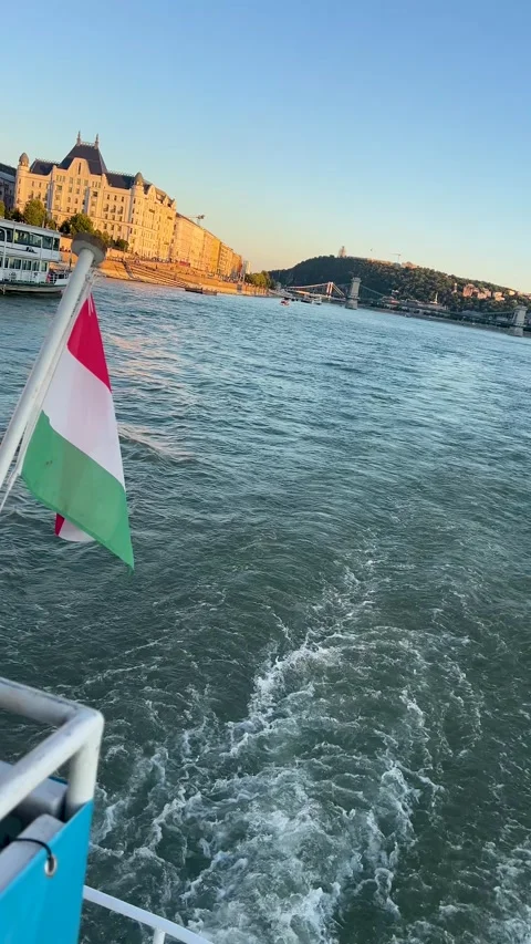 Stunning view of a river cruise in Budapest with the Hungarian flag flying Stock Footage 292551851