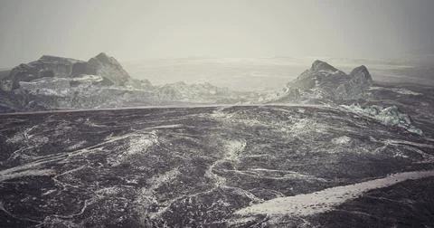 Stunning view of rugged terrain under misty conditions in a remote landscape 스톡 일러스트
