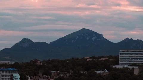 A stunning view showcases a mountain range under a vivid twilight sky, with Video stock 312147743