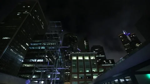 Stunning view of the skyscraper at night with bright lights and illuminated sky Stock Footage 155791109