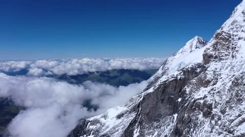 Stunning view of Tall mountains standing above clouds Stock Footage 247797403