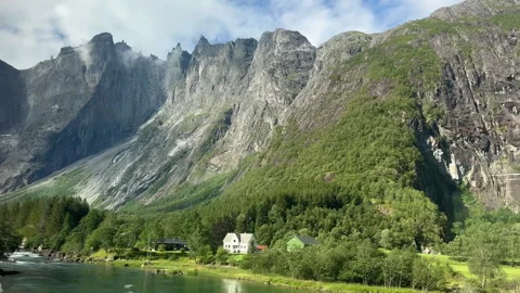 A stunning view of towering Norwegian mountains reflecting in tranquil waters Stock Footage 313945976