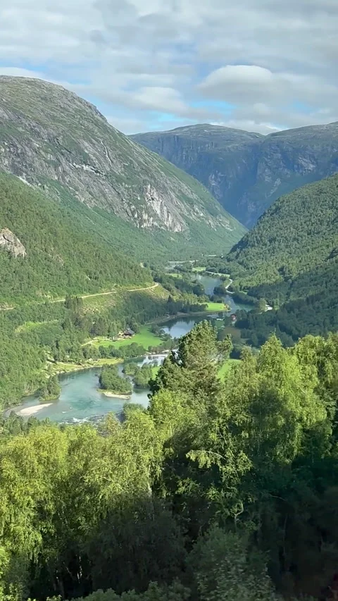 A stunning view of towering Norwegian mountains reflecting in tranquil waters Video stock 313946735