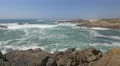 A stunning view of waves crashing on rocks, Porto 4k or 4k+ Resolution