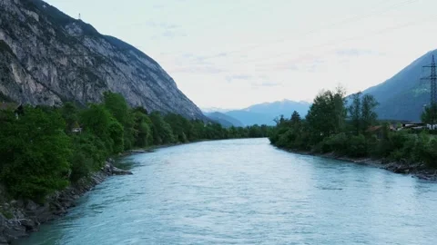 Stunning view of a wide, turquoise river rapidly flowing through a picturesque Stock Footage 339467253