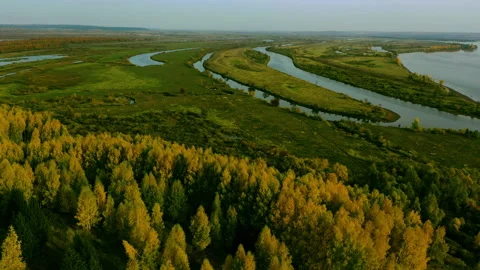 Stunning view of the winding river beyond the hill filmed with a copter. Stock Footage 142922469
