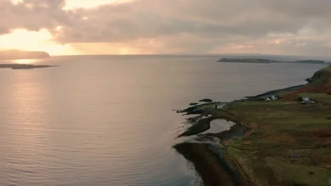 Stunning views of the Isle of Skye coast with low clouds and pink sunset Stock Footage 167693232