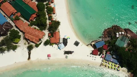 Stunning views of long beach with clear turquoise waters and tourists on Redang Stock Footage 319682269
