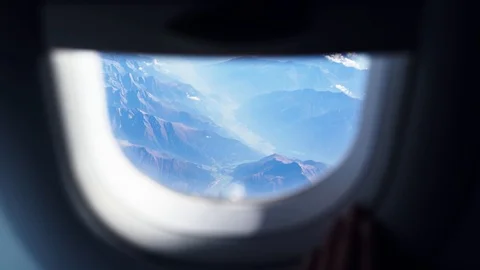 Stunning views of the mountains through the window of the aircraft. Stock-Footage 98457733
