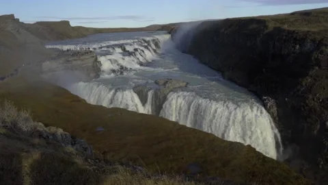 Stunning views of the two-level Gullfoss waterfall. Beautiful waterfall in sunny Stock Footage 130442932