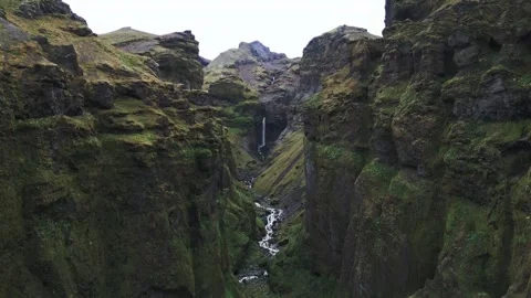Stunning views of a waterfall in a remote canyon Stock Footage 320293364