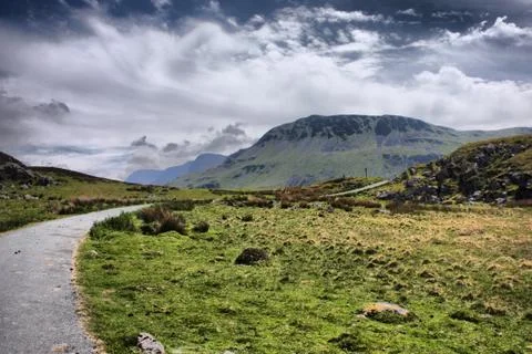 Stunning welsh mountains under a cloudy blue sky Stock Photos