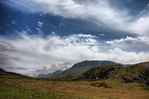 Stunning welsh mountains under a cloudy blue sky Stock Photos