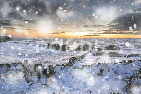 Stunning Winter sunset over snow covered Winter landscape in Peak District in Stock Photos