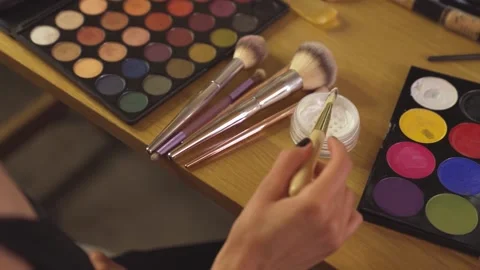 Stunning women applying make up setting powder Stock Footage 322202081