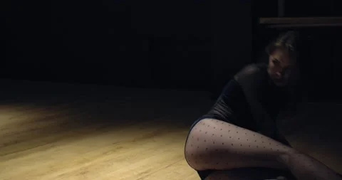 Stunning young lady is dancing on the floor, practicing in the gym, 4k Video stock 135647290