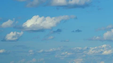 Stunningly Beautiful Cloud Patterns Gracefully Displayed Against a Bright Blue S Stock Photos