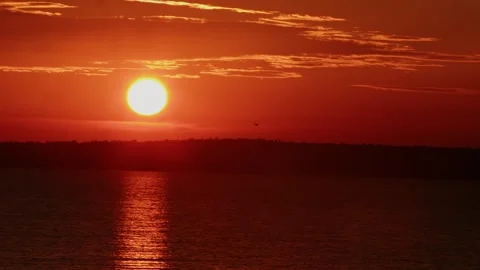 Stunningly beautiful sight of red sky at sunset and bright path from sun on 動画素材 313605043