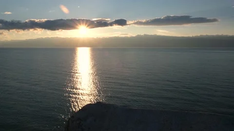 A stunningly beautiful sunset with the sun's rays shining through the clouds. Stock Footage 145390347