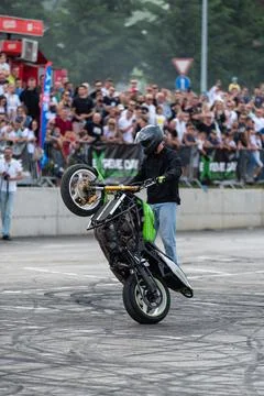 Stunt driver do acrobatics with their motorbike Stock Photos