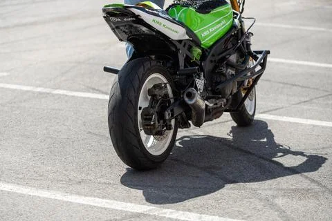 Stunt driver doing acrobatics and stunts with his motorbike Stock Photos