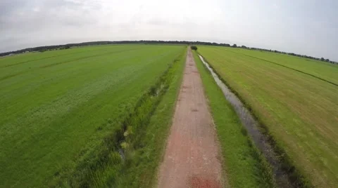 Stunt drone flying too low over path almost crashing accident into ground 4k Stock Footage 52120202