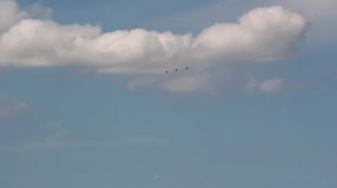 Stunt flyers passing by Stock Footage 26576784